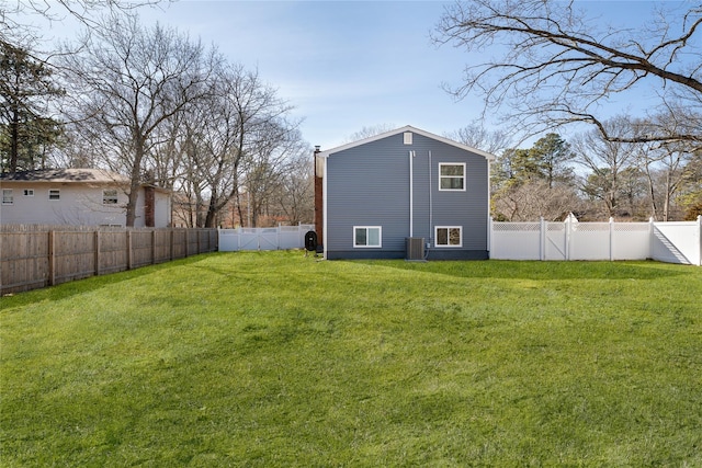 exterior space featuring central air condition unit and a fenced backyard