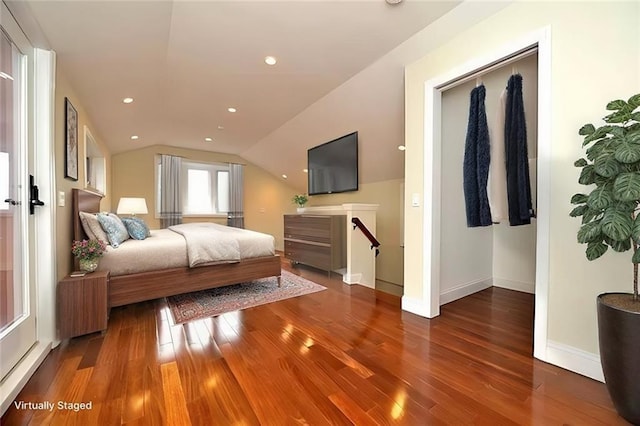 bedroom with recessed lighting, baseboards, lofted ceiling, and wood finished floors