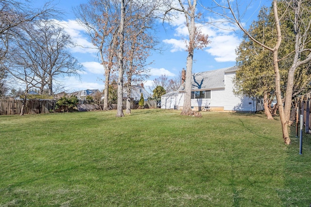 view of yard with a fenced backyard