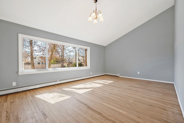 empty room featuring lofted ceiling, wood finished floors, an inviting chandelier, a baseboard radiator, and baseboards