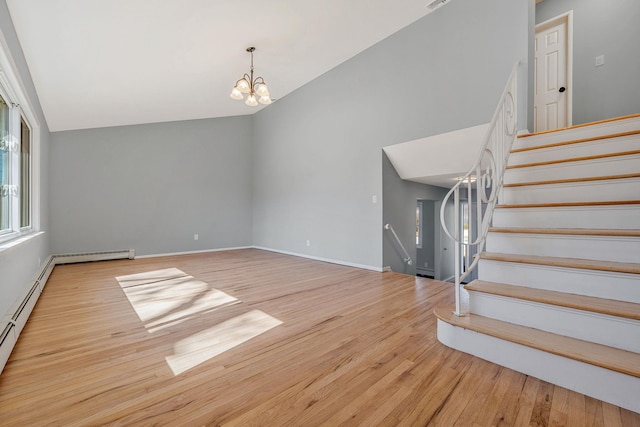 interior space featuring high vaulted ceiling, baseboards, an inviting chandelier, and wood finished floors