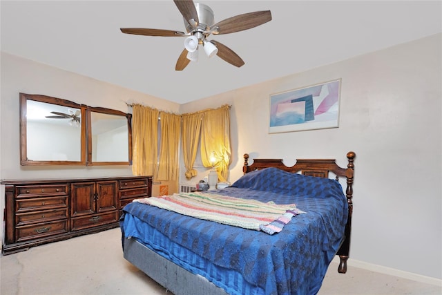 bedroom with baseboards, light colored carpet, and ceiling fan