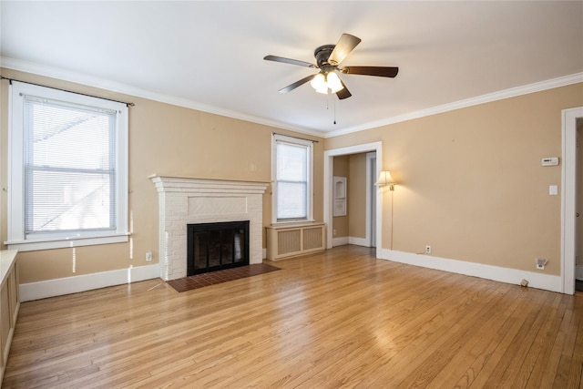 unfurnished living room featuring crown molding and light wood-style floors