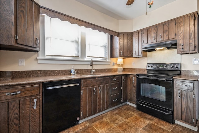 kitchen with a sink, black appliances, dark brown cabinets, under cabinet range hood, and dark countertops