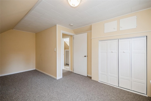 additional living space featuring lofted ceiling, carpet, and baseboards