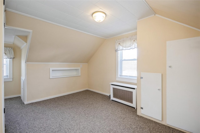 bonus room featuring carpet flooring, baseboards, radiator heating unit, and lofted ceiling