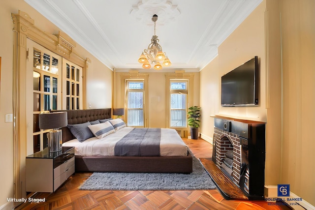 bedroom featuring baseboards, a raised ceiling, an inviting chandelier, and crown molding