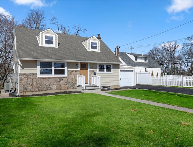 cape cod home with central air condition unit, driveway, fence, a front yard, and a garage