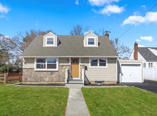 view of front of house featuring driveway, a front yard, and fence