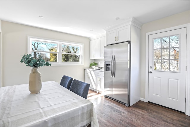 dining room featuring baseboards and dark wood-style floors