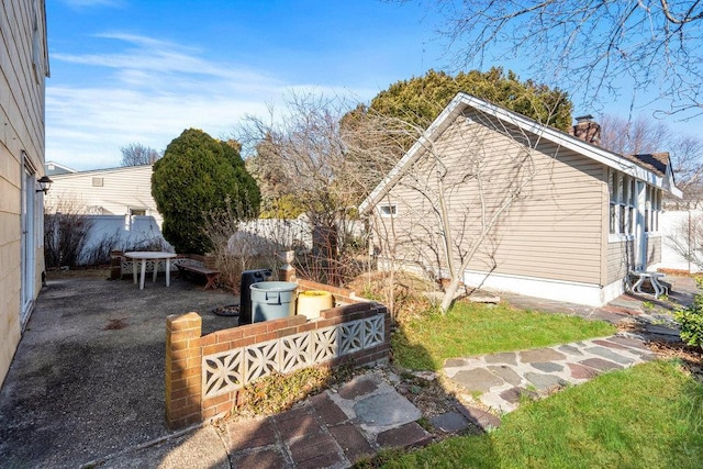 view of yard with a patio and fence