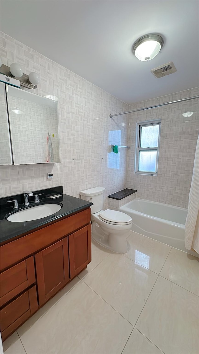 full bath with tile patterned floors, visible vents, bathing tub / shower combination, and toilet