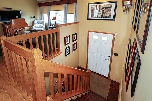 foyer entrance featuring baseboards and wood finished floors