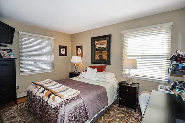 bedroom featuring dark wood-type flooring