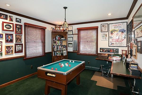 rec room with crown molding, baseboards, and carpet floors