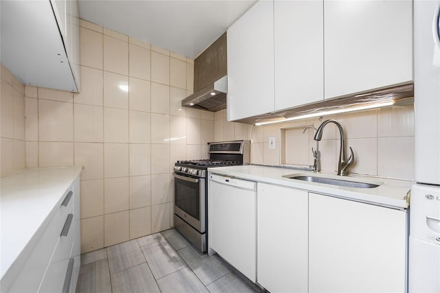 kitchen with ventilation hood, stainless steel gas range, a sink, light countertops, and dishwasher