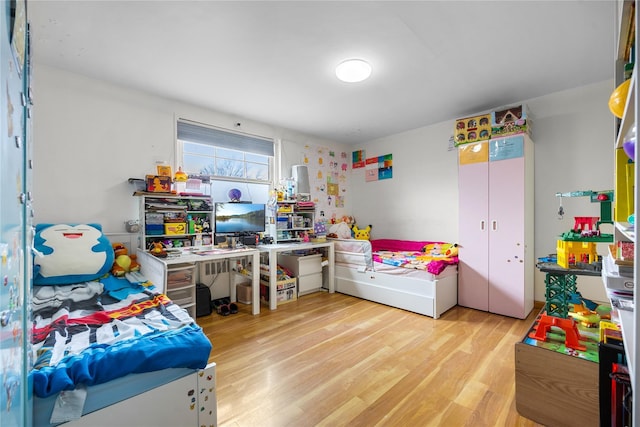 bedroom with light wood-style floors