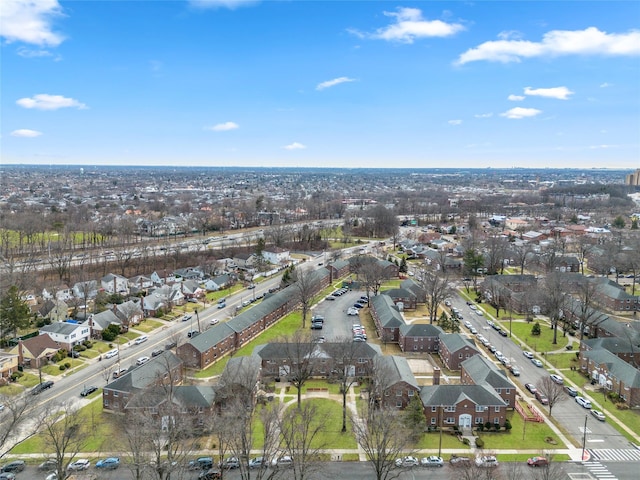 birds eye view of property with a residential view