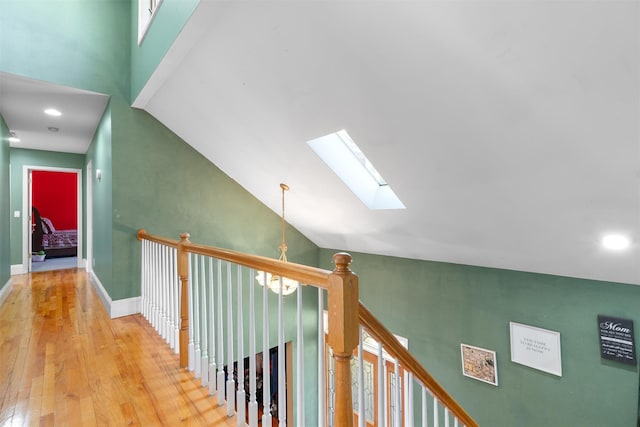 441 County Route 48, Thompson Ridge, NY 10985 - hallway with a skylight, baseboards, wood-type flooring, and high vaulted ceiling