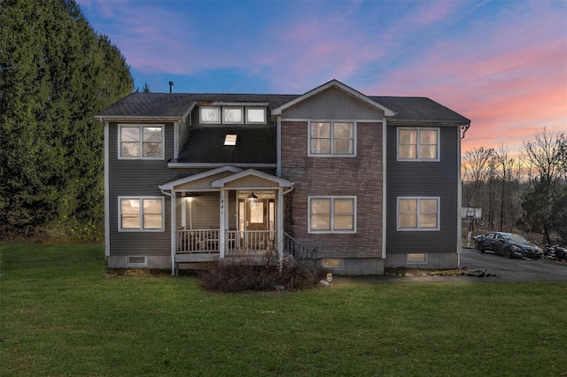 441 County Route 48, Thompson Ridge, NY 10985 - view of front facade featuring stone siding, covered porch, and a front yard