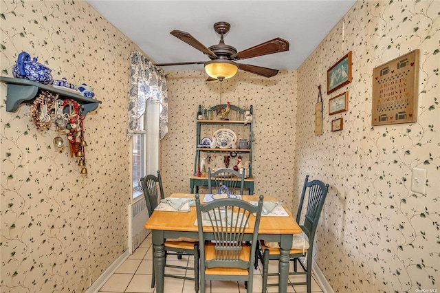 dining area with ceiling fan, baseboards, light tile patterned flooring, and wallpapered walls