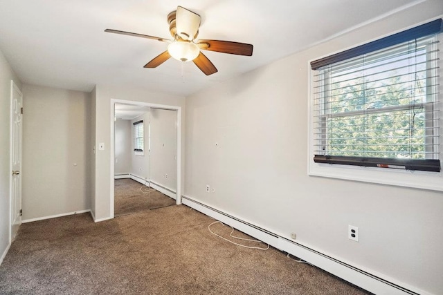 unfurnished room with baseboard heating, ceiling fan, baseboards, and carpet floors