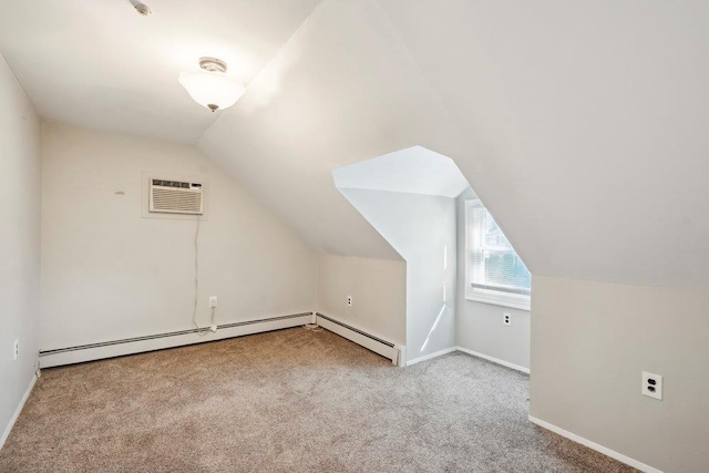 bonus room with a wall mounted air conditioner, carpet, a baseboard radiator, baseboards, and vaulted ceiling