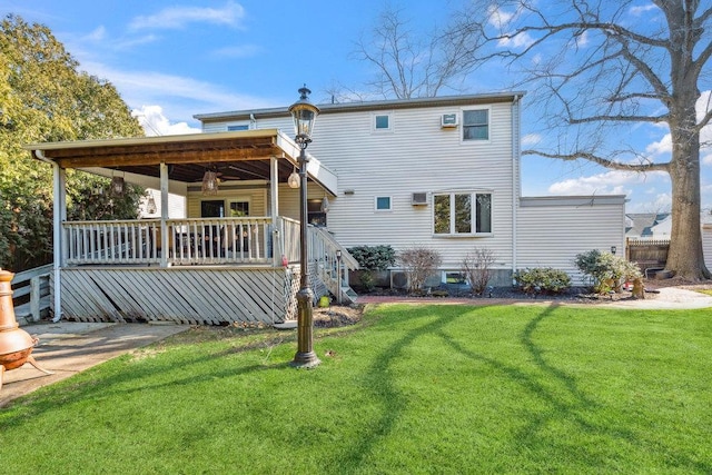 back of house featuring a lawn