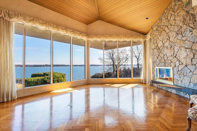 unfurnished sunroom featuring a water view