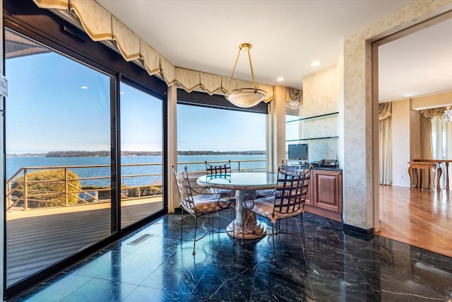dining area with marble finish floor, visible vents, wallpapered walls, and recessed lighting