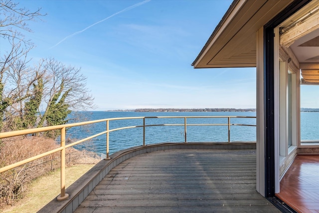 exterior space with a balcony and a water view
