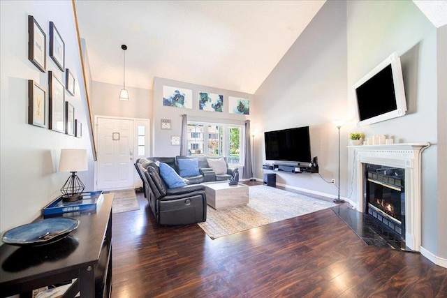 10 Lyford Ln, Poughkeepsie, NY 12601 - living room with high vaulted ceiling, wood finished floors, and a fireplace