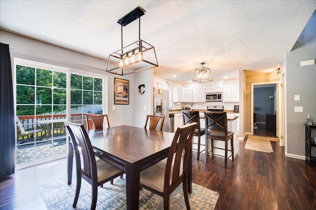 10 Lyford Ln, Poughkeepsie, NY 12601 - dining room with dark wood-style flooring, a textured ceiling, a chandelier, and recessed lighting