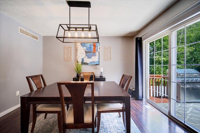 10 Lyford Ln, Poughkeepsie, NY 12601 - dining area with dark wood finished floors and a textured ceiling