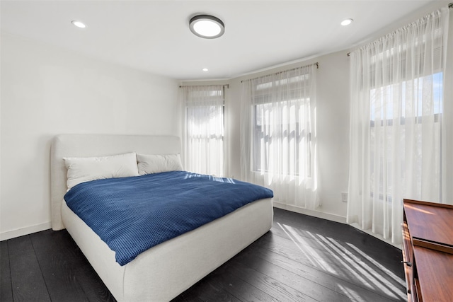 bedroom featuring recessed lighting, baseboards, and dark wood-style floors