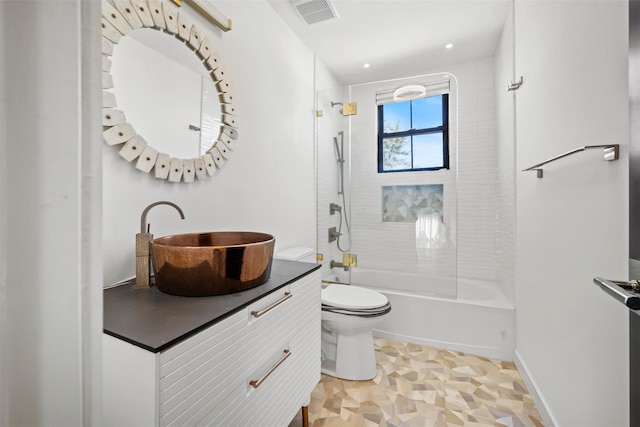 full bathroom with vanity, baseboards, visible vents,  shower combination, and toilet