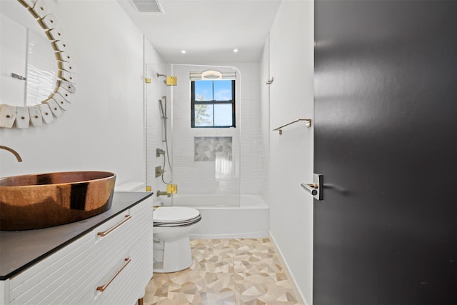 full bathroom with vanity, baseboards, visible vents, shower / bathing tub combination, and toilet