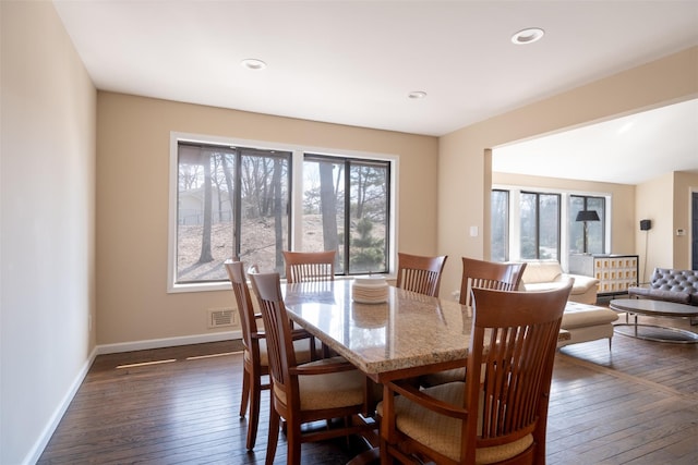 dining space with visible vents, recessed lighting, baseboards, and dark wood-style flooring