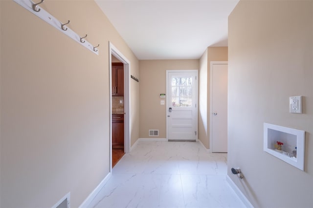 interior space with visible vents, marble finish floor, and baseboards