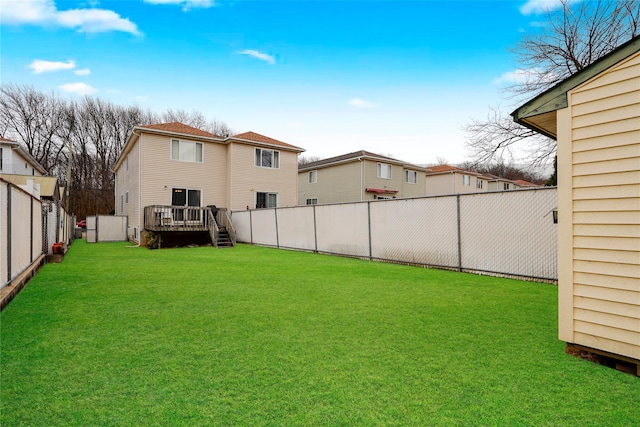 view of yard with a deck and a fenced backyard