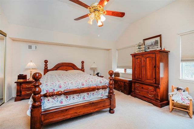 bedroom with light carpet, visible vents, a ceiling fan, and lofted ceiling