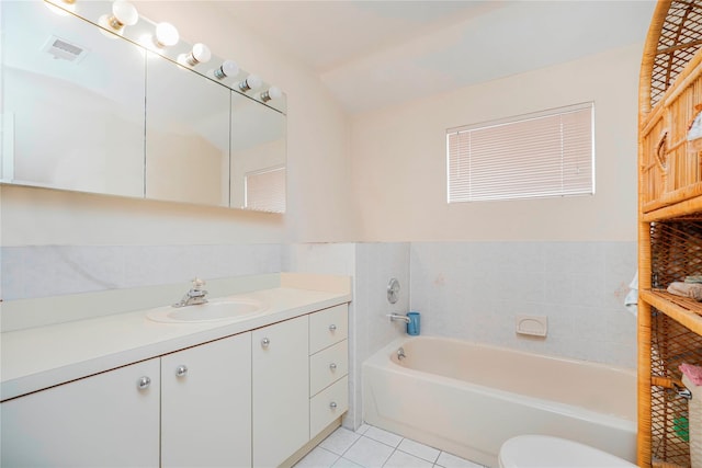 full bathroom with tile patterned floors, visible vents, lofted ceiling, a bath, and vanity