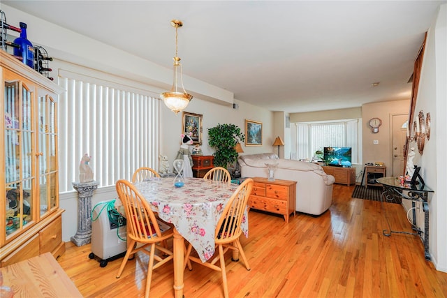 dining area featuring light wood-style flooring