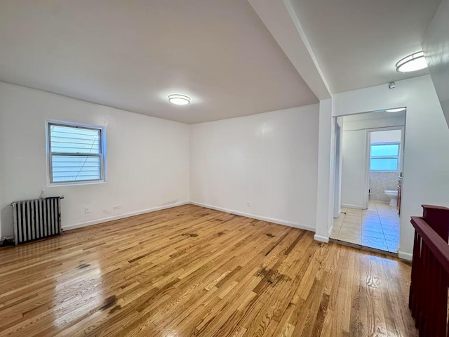 94-17 42nd Ave, Elmhurst, NY 11373 - interior space with radiator, light wood finished floors, and baseboards