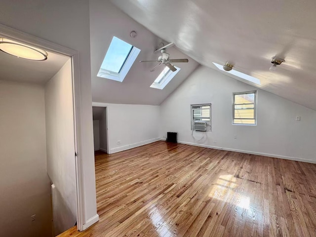 94-17 42nd Ave, Elmhurst, NY 11373 - bonus room featuring lofted ceiling with skylight, a ceiling fan, wood finished floors, and baseboards