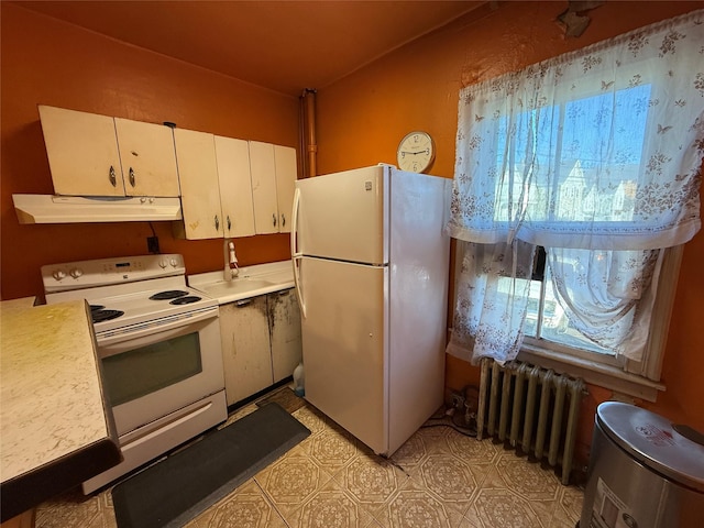 kitchen featuring white appliances, radiator, light countertops, white cabinets, and under cabinet range hood