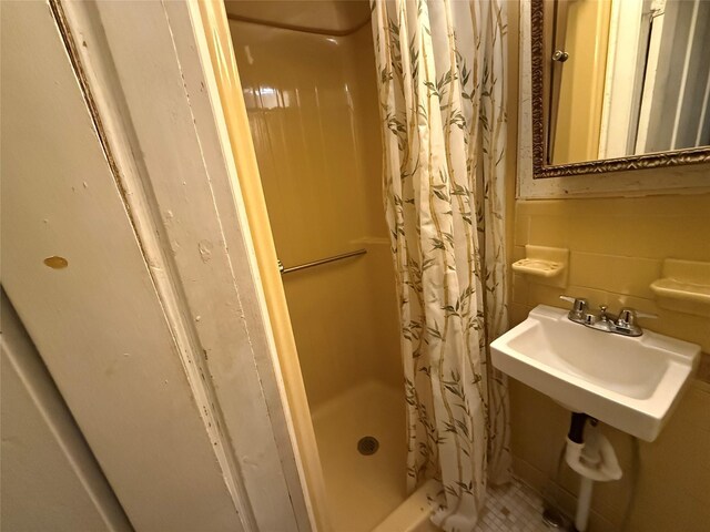 119 Verplanck Ave, Beacon, NY 12508 - bathroom with a shower stall, a sink, and tile walls