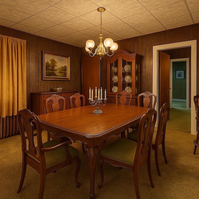 119 Verplanck Ave, Beacon, NY 12508 - dining area featuring light carpet, a chandelier, and wood walls