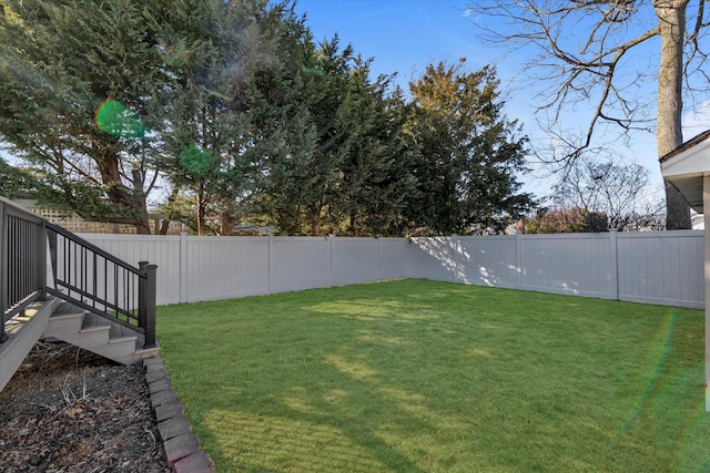 view of yard with a fenced backyard