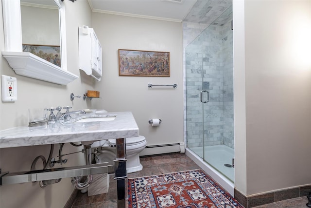 full bathroom with baseboards, a sink, a shower stall, toilet, and baseboard heating